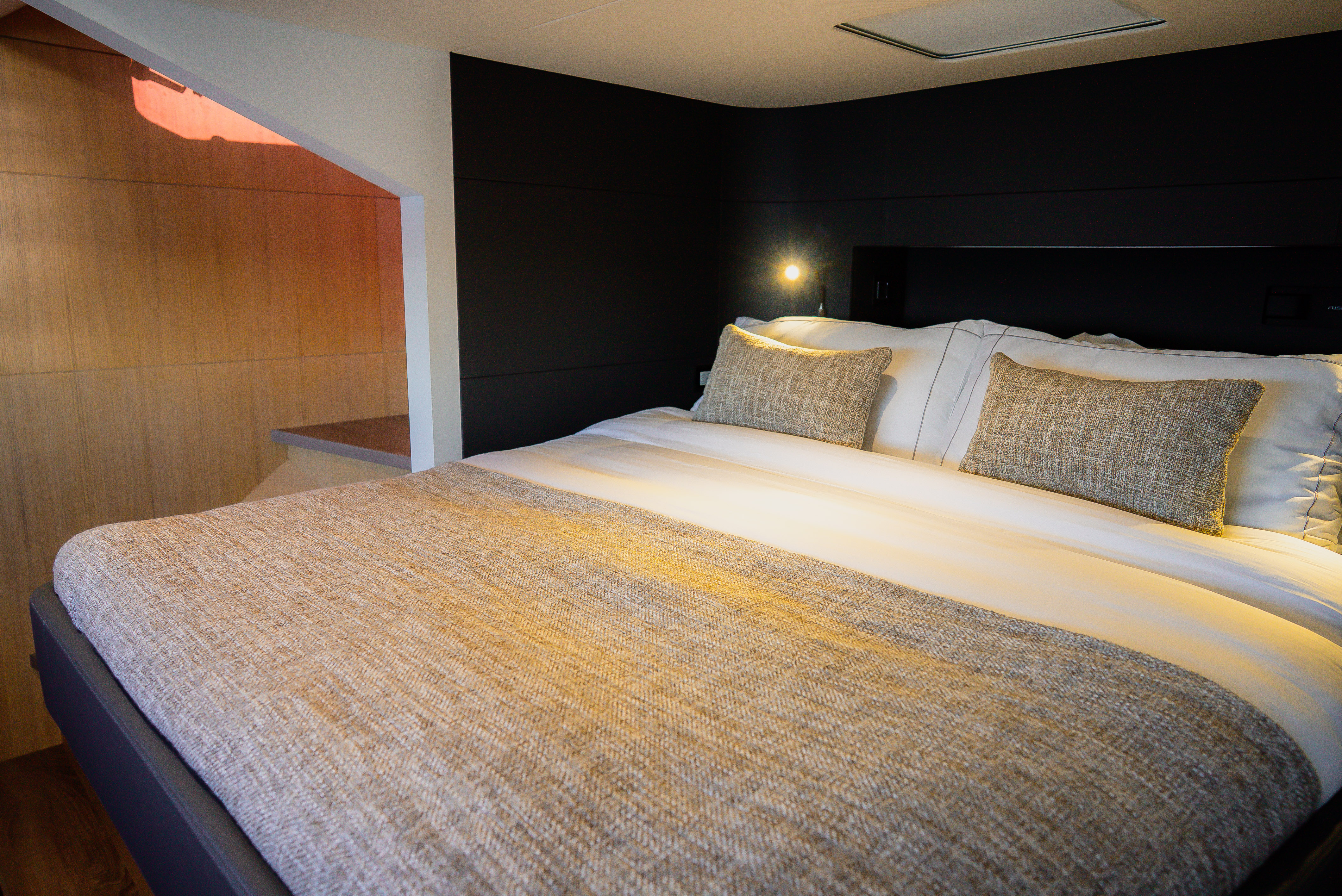 Spacious master cabin with large bed and elegant furnishings